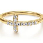 14 KARAT YELLOW GOLD SIDEWAYS DIAMOND CROSS RING.